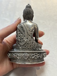 A fine Nepalese silver Buddha, 20th C.
