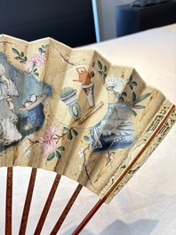 A chinoiserie folding fan, watercolour on paper and bone, France, early 19th C.