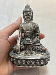 A fine Nepalese silver Buddha, 20th C.