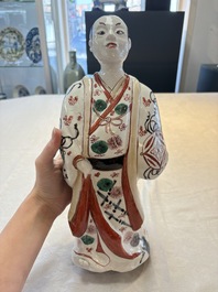 A Japanese Arita Imari figure of a samurai dressed in a kimono, Edo, 17/18th C.