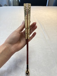 A chinoiserie folding fan, watercolour on paper and bone, France, early 19th C.