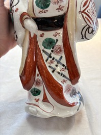 A Japanese Arita Imari figure of a samurai dressed in a kimono, Edo, 17/18th C.