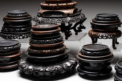 A collection of 25 Chinese wooden stands, 19/20th C.
