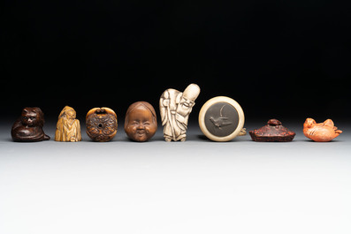 A varied collection of eight Japanese netsukes and a wooden case, signed Daimyo 大明, Hinode 日出 and Chikusen 竹仙, 19th C.