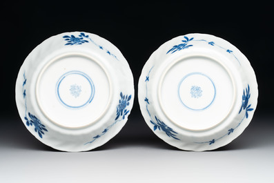 A set of four Chinese blue and white cups and saucers, flower mark, 19th C.