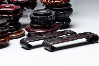 A collection of 80 Chinese wooden stands, 19/20th C.