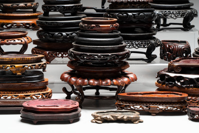 A collection of 51 Chinese wooden stands, 19/20th C.