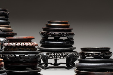 A collection of 51 Chinese wooden stands, 19/20th C.