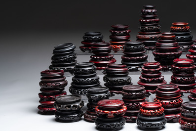 A collection of 80 Chinese wooden stands, 19/20th C.
