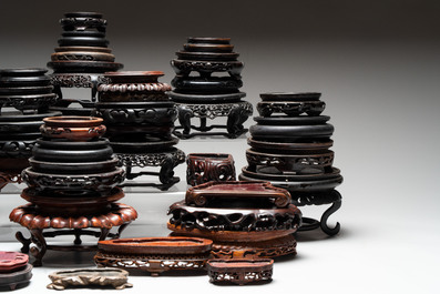 A collection of 51 Chinese wooden stands, 19/20th C.