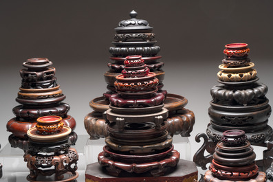 A collection of 70 Chinese wooden stands and covers, 19/20th C.