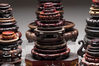 A collection of 70 Chinese wooden stands and covers, 19/20th C.