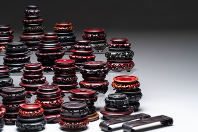 A collection of 80 Chinese wooden stands, 19/20th C.