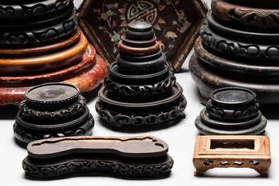 A collection of 37 Chinese wooden stands, 19/20th C.