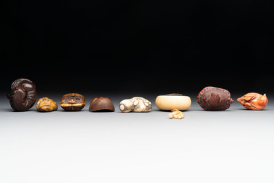 A varied collection of eight Japanese netsukes and a wooden case, signed Daimyo 大明, Hinode 日出 and Chikusen 竹仙, 19th C.