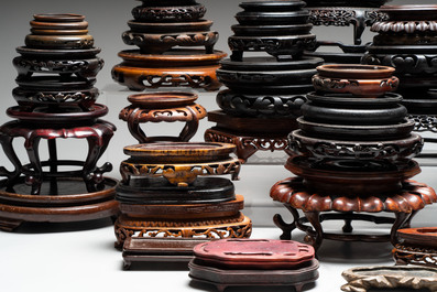 A collection of 51 Chinese wooden stands, 19/20th C.