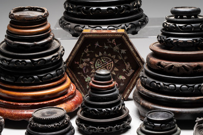 A collection of 37 Chinese wooden stands, 19/20th C.