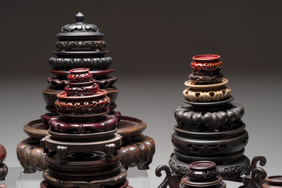 A collection of 70 Chinese wooden stands and covers, 19/20th C.