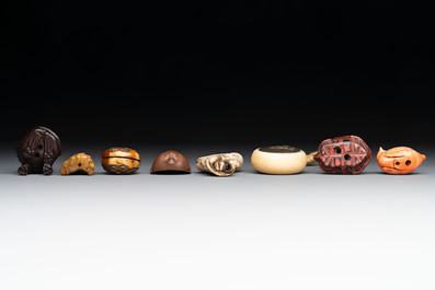 A varied collection of eight Japanese netsukes and a wooden case, signed Daimyo 大明, Hinode 日出 and Chikusen 竹仙, 19th C.