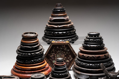 A collection of 37 Chinese wooden stands, 19/20th C.