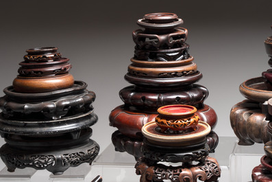 A collection of 70 Chinese wooden stands and covers, 19/20th C.