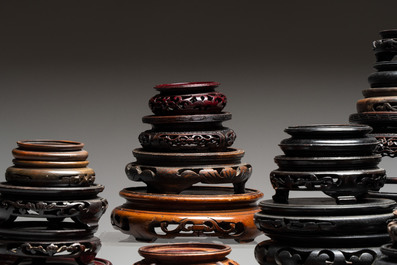 A collection of 51 Chinese wooden stands, 19/20th C.