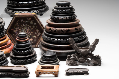 A collection of 37 Chinese wooden stands, 19/20th C.