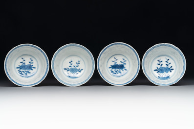 A set of four Chinese blue and white cups and saucers, flower mark, 19th C.