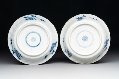 A set of four Chinese blue and white cups and saucers, flower mark, 19th C.