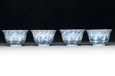 A set of four Chinese blue and white cups and saucers, flower mark, 19th C.