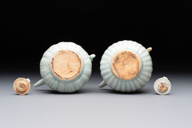 A pair of Chinese qingbai ewers and covers with dragon-form handles, Song/Yuan