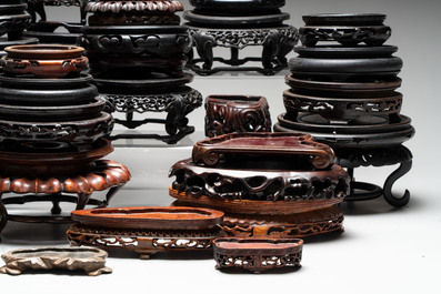 A collection of 51 Chinese wooden stands, 19/20th C.