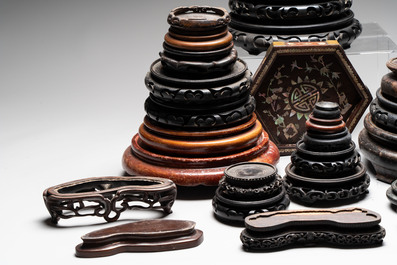 A collection of 37 Chinese wooden stands, 19/20th C.