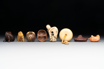 A varied collection of eight Japanese netsukes and a wooden case, signed Daimyo 大明, Hinode 日出 and Chikusen 竹仙, 19th C.
