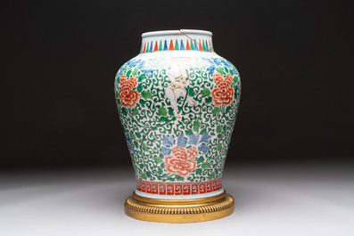A Chinese wucai 'He He Er Xian' vase on gilt-bronze stand, 19th C.