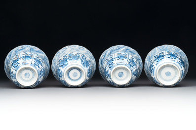A set of four Chinese blue and white cups and saucers, flower mark, 19th C.
