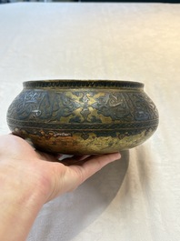 A Persian silver- and copper-inlaid 'calligraphic' brass bowl, 18th C.