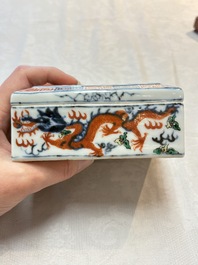 A Chinese wucai covered box, a blue and white ewer, a famille rose covered box and a plate, Wanli, Kangxi and Guangxu mark, 19/20th C.