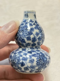 A Chinese blue and white double-gourd snuff bottle and a huali snuff bottle, Xuande and Qianlong mark, 18th C.