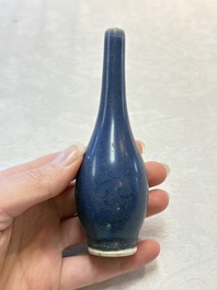 A pair of Chinese blue-glazed 'Hatcher Cargo' bottle vases with incised dragons, Transitional period