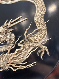 A large Japanese mother-of-pearl and bone-inlaid lacquer 'dragon' dish, Meiji, 19th C.