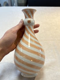 A rare pair of Chinese pear-shaped bottle vases with iron-red swirls, Kangxi