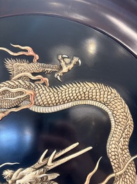 A large Japanese mother-of-pearl and bone-inlaid lacquer 'dragon' dish, Meiji, 19th C.