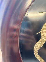 A large Japanese mother-of-pearl and bone-inlaid lacquer 'dragon' dish, Meiji, 19th C.