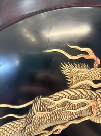 A large Japanese mother-of-pearl and bone-inlaid lacquer 'dragon' dish, Meiji, 19th C.