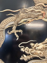 A large Japanese mother-of-pearl and bone-inlaid lacquer 'dragon' dish, Meiji, 19th C.