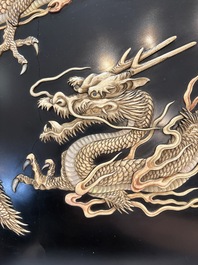 A large Japanese mother-of-pearl and bone-inlaid lacquer 'dragon' dish, Meiji, 19th C.