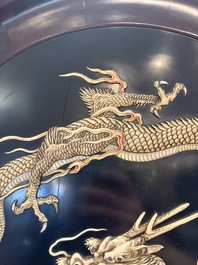 A large Japanese mother-of-pearl and bone-inlaid lacquer 'dragon' dish, Meiji, 19th C.