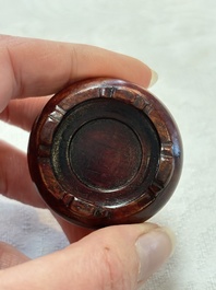 A Chinese blue and white double-gourd snuff bottle and a huali snuff bottle, Xuande and Qianlong mark, 18th C.