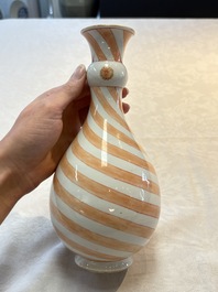 A rare pair of Chinese pear-shaped bottle vases with iron-red swirls, Kangxi